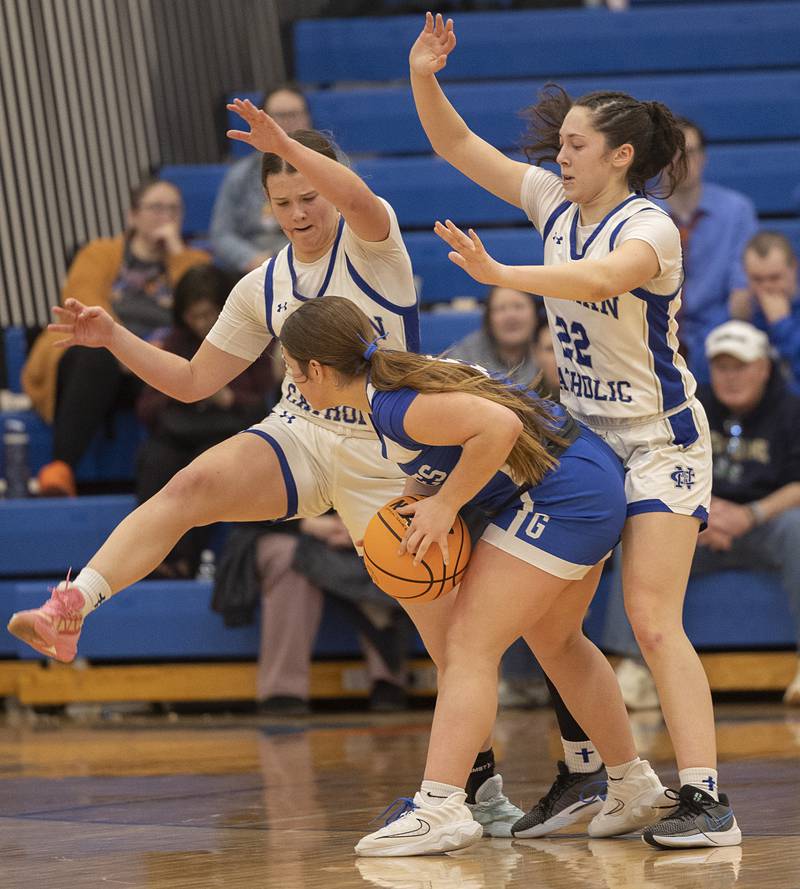 Newman’s Lucy Oetting (left) and Anna Propheter guard Galena’s Chesnie Rosenthal Tuesday, Feb. 24, 2026, in the Class 1A sectional at Eastland High School.