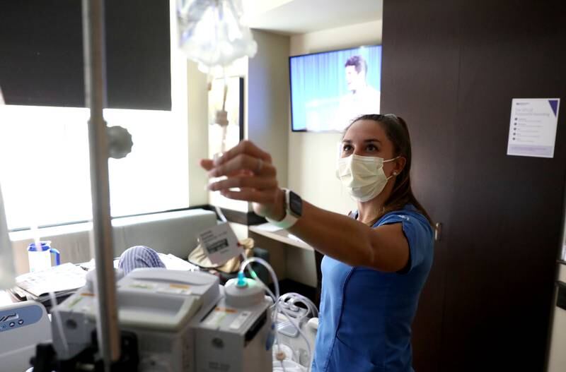 Northwestern Medicine Delnor Hospital Registered Nurse Samantha Markelz checks in on a patient on Wednesday, Aug. 3, 2022. Northwestern Medicine Delnor Hospital is launching a new pilot program to hire licensed practical nurses to address nursing shortages.