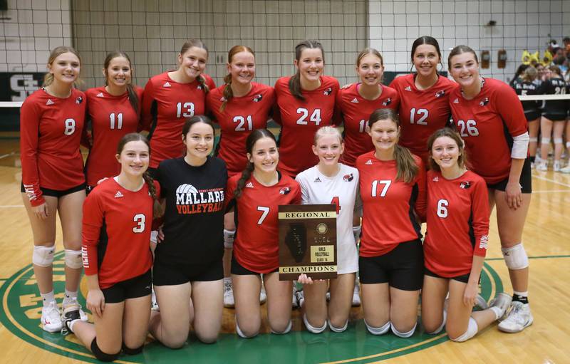 Members of the Henry-Senachwine volleyball team pose with the Class 1A Regional plaque after defeating St. Bede on Thursday, Oct. 31, 2024 at St. Bede Academy.