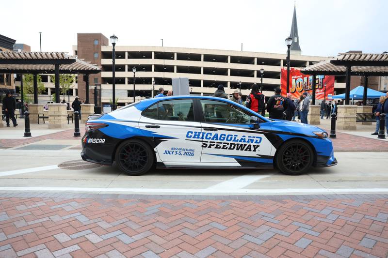 A car promoting the return of NASCAR to the Chicagoland Speedway this summer is part of the car show at the opening of Joliet's City Square downtown on Friday, May 1, 2026.