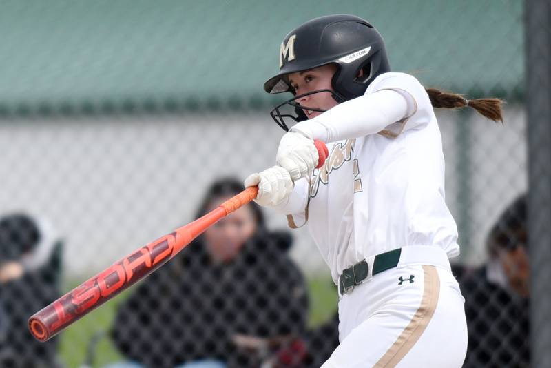 Bishop McNamara's Sophia Piggush follows through on her two-run double during a home game against St. Laurence Saturday, April 11, 2026.