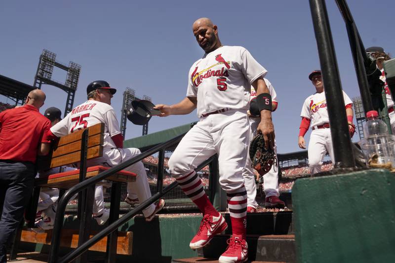 St. Louis Cardinals first baseman Albert Pujols walks down the stairs of the dugout after playing during the first inning of a baseball game against the Cincinnati Reds Sunday, Sept. 18, 2022, in St. Louis. (AP Photo/Jeff Roberson)