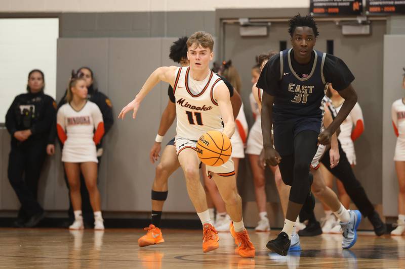 Minooka’s Brady Hairald takes the rebound up court against Oswego East on Friday, Jan. 16, 2026 in Minooka.