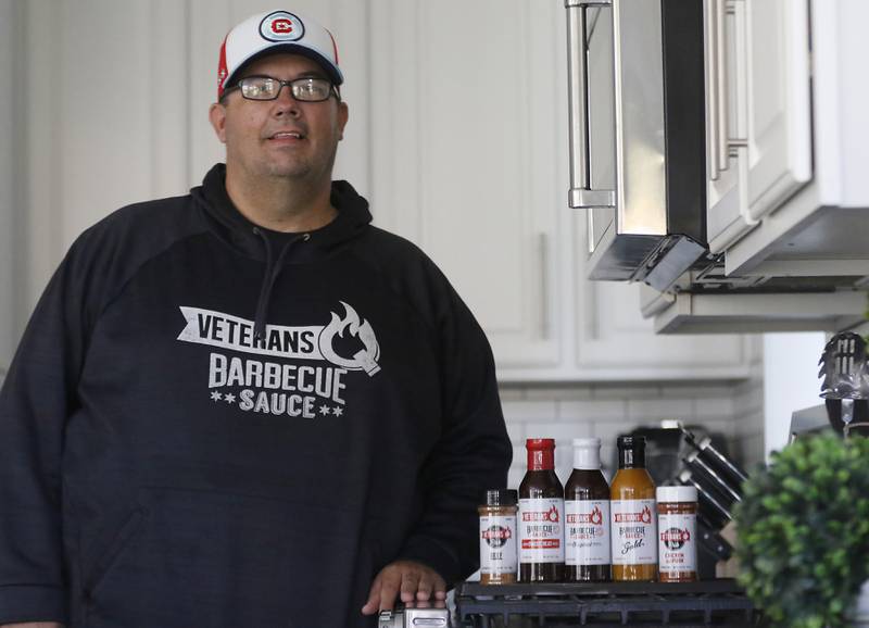Veteran Steve Lulofs, the president of Veterans Q Barbecue Sauces & Dry Rubs and Veterans Barbecue & Catering, inside his home in Algonquin on Monday, Oct. 30, 2023, 50% of Veterans Q's profits are donated to veteran organizations.