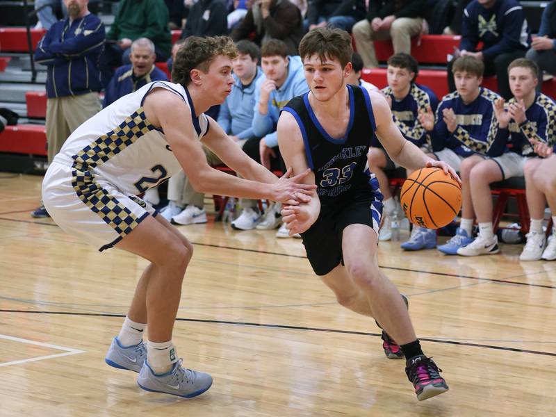 Hinckley-Big Rock's Marshall  Ledbetter goes baseline against Marquette's Lucas Craig Tuesday, March 3, 2026, during their sectional semifinal matchup at Amboy High School.