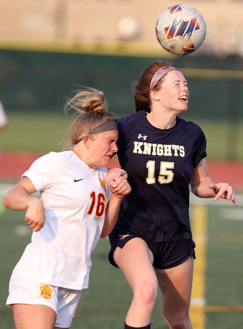 IC Catholic's Allie Geiger (15) heads the ball as Richmond-Burton's Alexa Anderson (16) collides with her during the IHSA Class 1A girls soccer super-sectional match between Richmond-Burton and IC Catholic at Concordia University in River Forest on Tuesday, May 23, 2023.