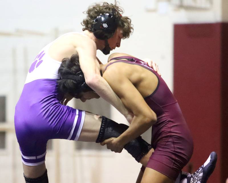 Prairie Ridge’s Yoni Bueno, right, battles Hampshire’s Lou Jensen at 120 pounds in varsity boys wrestling on Thursday, Dec. 4, 2025, at  Prairie Ridge High School in Crystal Lake.