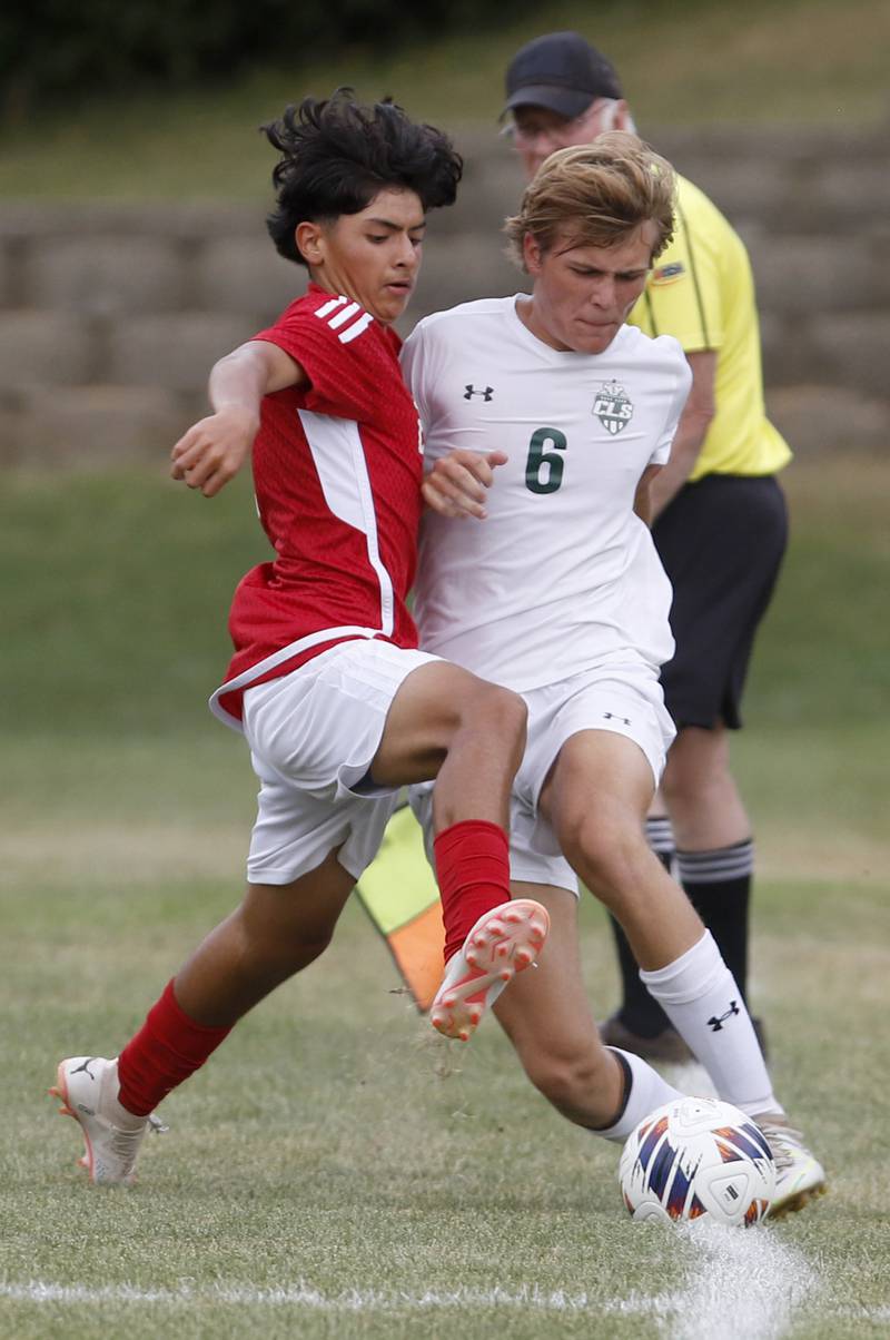 Dundee-Crown's Hugo Arista battles with Crystal Lake South's Blake Marunde for the ball during a Fox Valley Conference soccer match Tuesday, Sept. 5, 2023, at Dundee-Crown High School in Carpentersville.