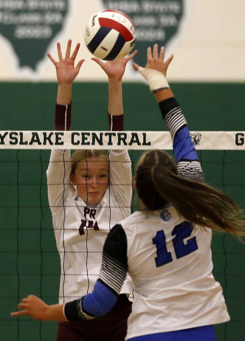 Prairie Ridge's Jada Hoyt blocks the hit of Prairie Ridge's Julia Reina during the IHSA Class 3A Grayslake Central Supersectional volleyball match on Monday, Nov. 11, 2024, at Grayslake Central High School.