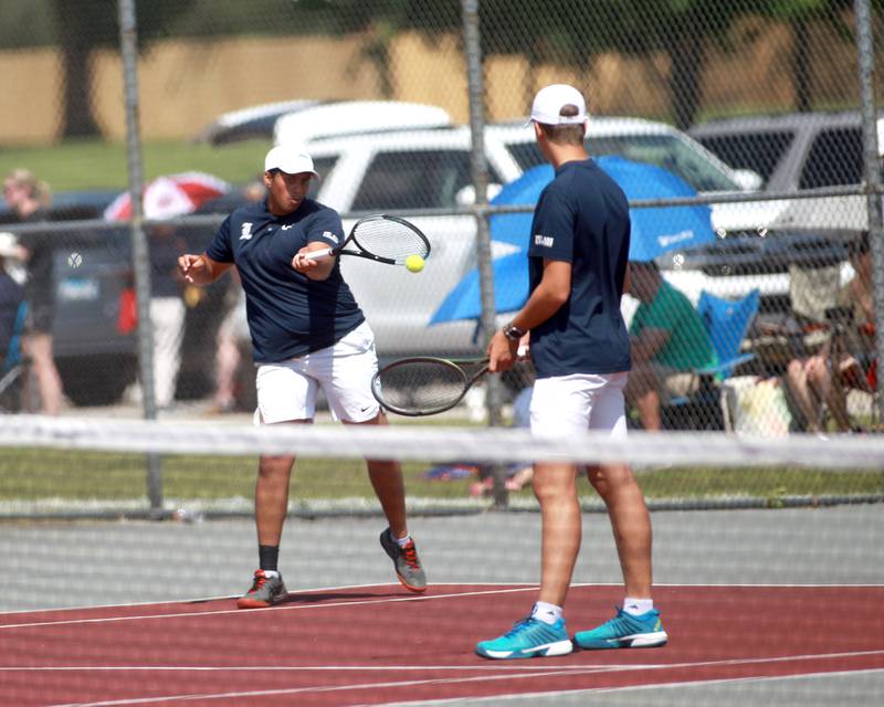 Lemont’s Rehan Saraiya returns the ball during a doubles match with partner Sean Svoboda (right) in the state championship preliminaries at Palatine High School on Thursday, May 23, 2024.