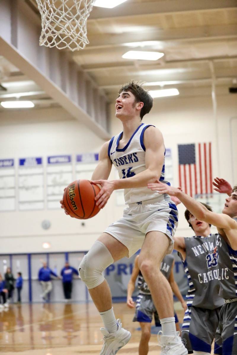 Princeton's Grady Thompson makes his moves against Newman Friday night at Prouty Gym. The Tigers won 80-32.