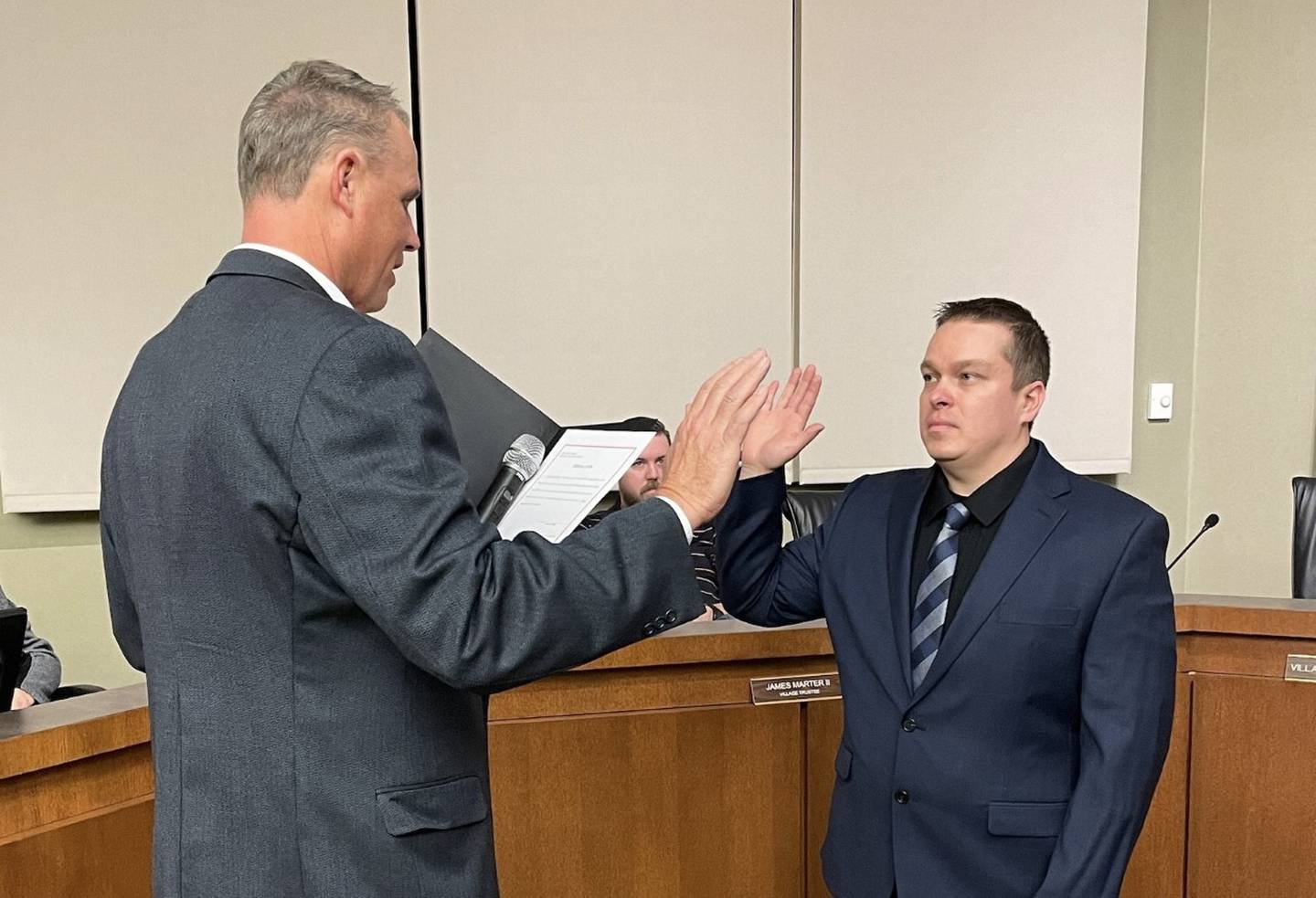 Officer Aaron Riley (right) was sworn-in as the Oswego Police Department's 52nd officer by Village President Troy Parlier (left) during a Village Board meeting on Jan. 12, 2023 at Village Hall in Oswego.