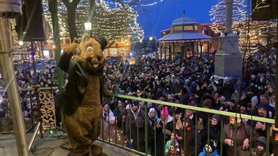 Woodstock Willie predicts an early spring in front of thousands gathered on the Square for Groundhog Day