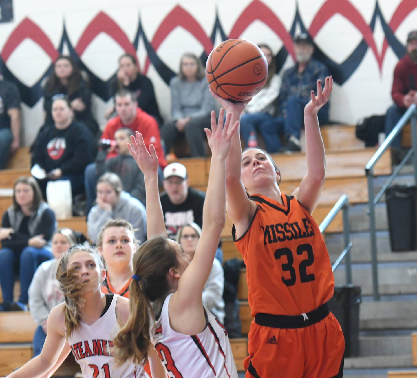 Milledgeville's Adriana Miller reaches for a rebound during Saturday regional action in Fulton.