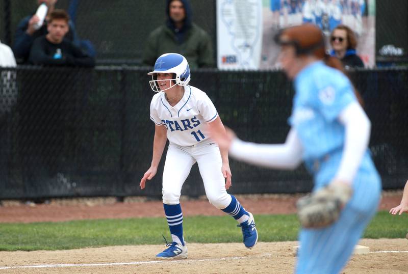 St. Charles North's Ivy Gleeson leads off from third base during a game against Lake Park on Wednesday, April 30, 2025 in St. Charles.