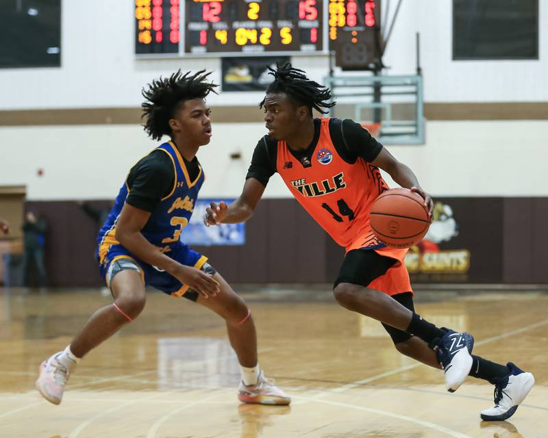 Romeoville's Kendall Cutler (14) drives to the basket in the WJOL Tournament Championship game. Nov 25, 2023.