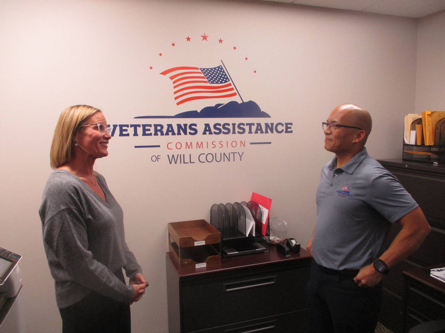 Jen Solum, superintendent with the Veterans Assistance Commision of Will County, meets with VAC employee Kristian Aquino at the agency office on Glenwood Avenue in Joliet. Oct. 20, 2025