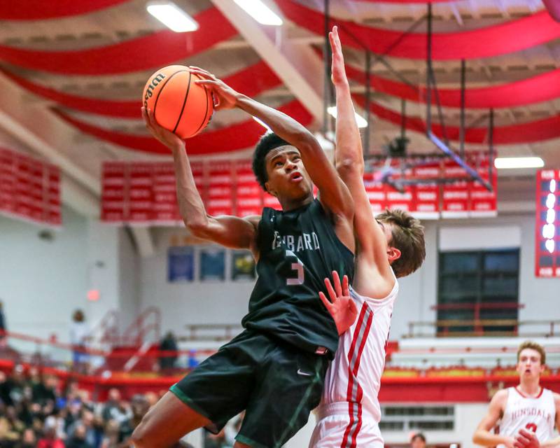 Glenbard West's TJ Williams (3) puts up a shot during their basketball game between Glenbard West at Hinsdale Central, Friday  Dec 6, 2024  in Hinsdale.
