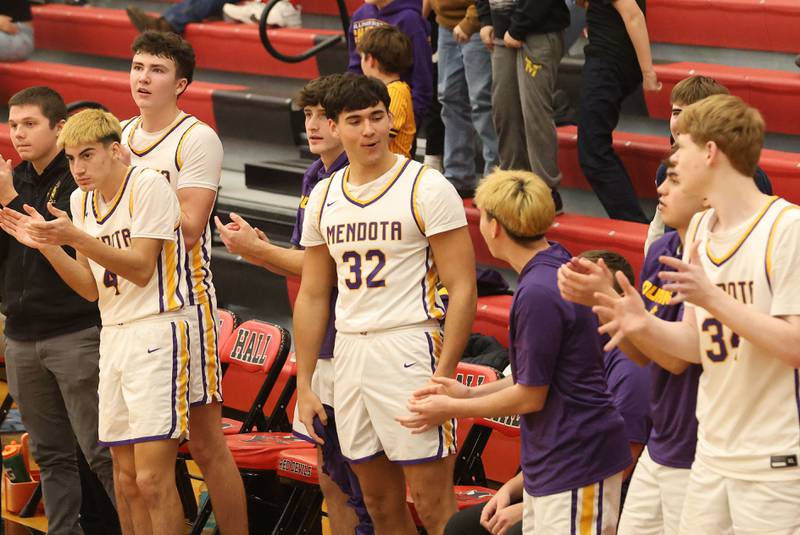 Members of the Mendota boys basketball team react after defeating Illinios Valley Central during the Colmone Classic on Friday, Dec. 12, 2025 at Hall High School.