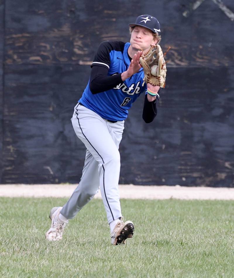 St. Charles North's Keaton Reinke makes a catch in the outfield during their game against Sycamore Thursday, April 10, 2025, at the Sycamore Park District Sports Complex.