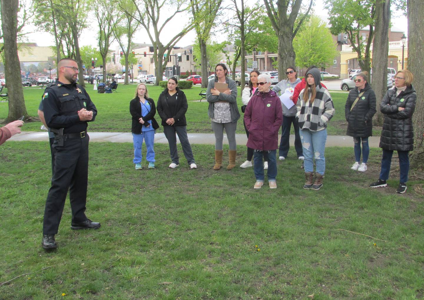 Ottawa Police Capt. Kyle Booras speaks to about 50 people in attendance Saturday, April 29, 2023, at Washinton Square in Ottawa, for the March to Believe organized by Safe Journeys.