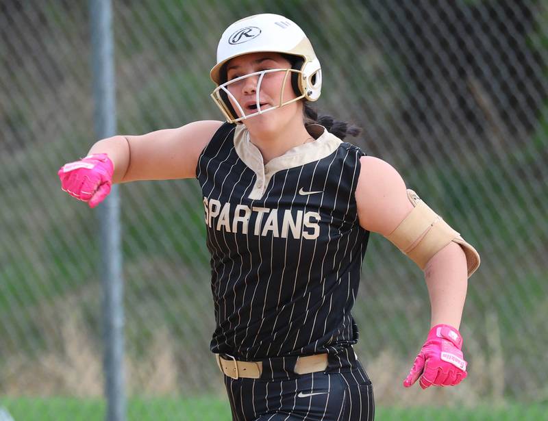 Sycamore's Kairi Lantz celebrates as she rounds the bases after homering Friday, April 17, 2026, during thier game against Ottawa at Sycamore High School.