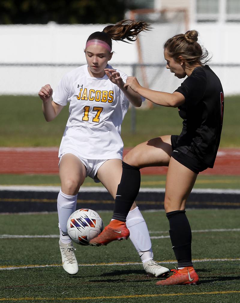 Huntley's Sophie Bator (right) takes a shot at the goal as Jacobs' Lauren Sandage defends during the IHSA Class 3A Huntley Girls Soccer Regional championship match on Friday, May 23, 2025, at Huntley High School.