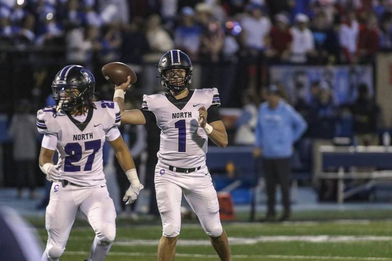 Downers Grove North's Owen Lansu (1) throws a short pass during football game between Downers Grove North at Downers Grove South Friday, Sept 5, 2025  in Downers Grove.