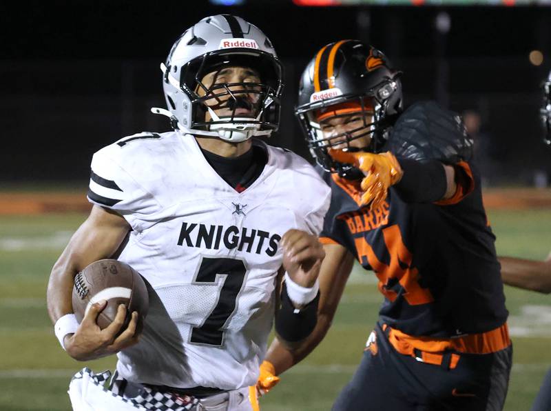 Kaneland's Jalen Carter just gets by DeKalb's Zion Watts for touchdown during their game Friday, Sept. 12, 2025, at DeKalb High School.