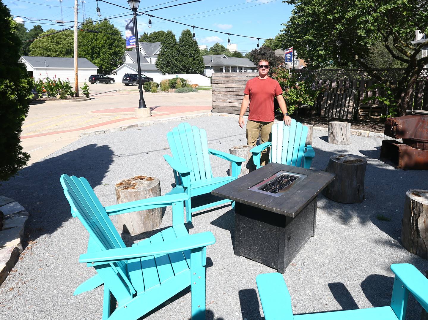 Dan Stash poses for a photo in the firepit area behind the Bickerman building on Wednesday, Aug. 24, 2022 in Utica.