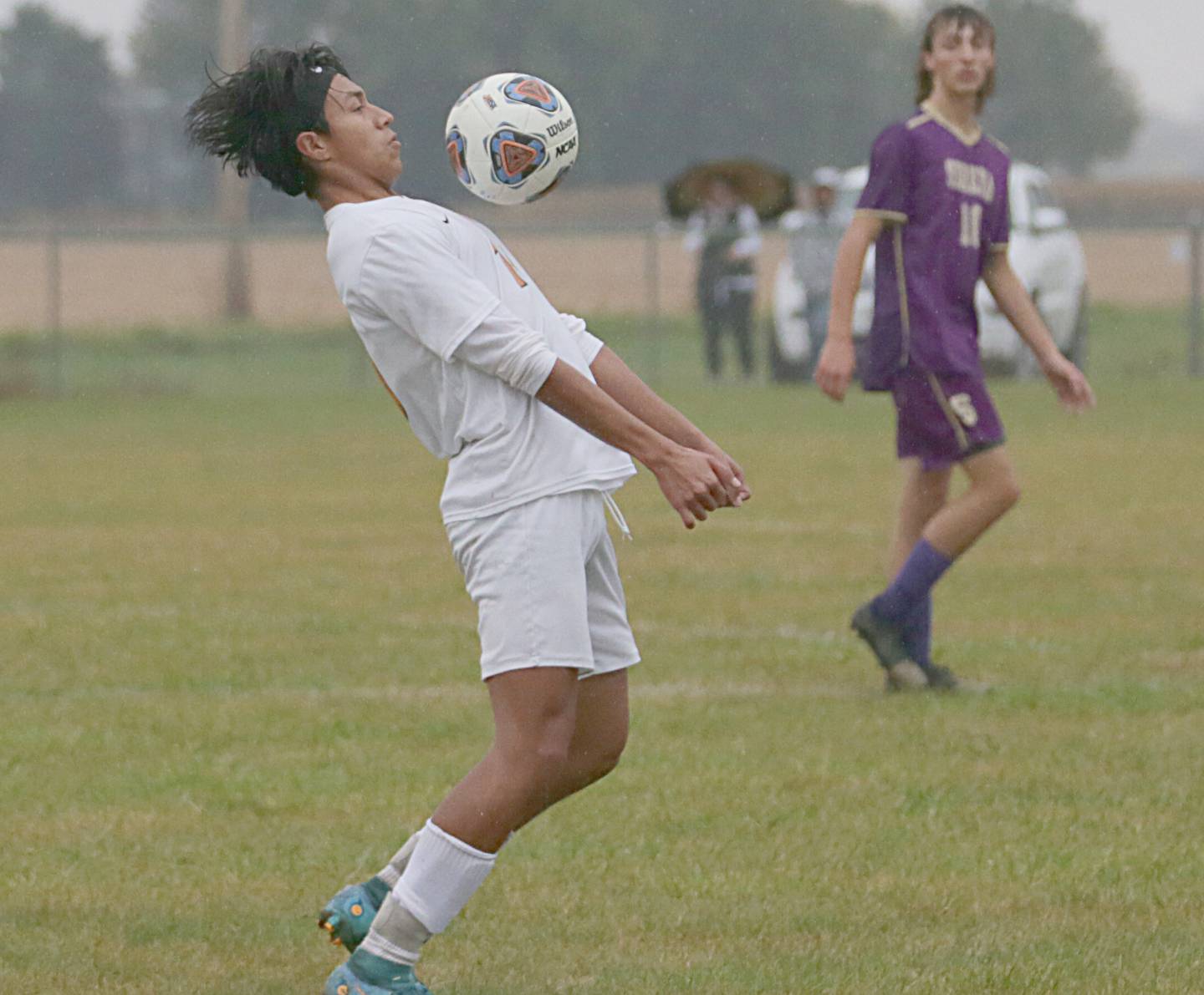 Sandwich's Xander Clark (10) knocks the ball down against Serena in the Class 1A Regional semifinal game on Tuesday, Oct. 11, 2022 in Serena.