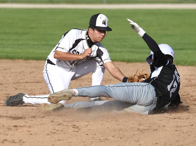 Sycamore's Sawyer Valdez tags out Kaneland's Brayden Boyer at second base Tuesday, April 28, 2026, during their game at the Sycamore Community Sports Complex.