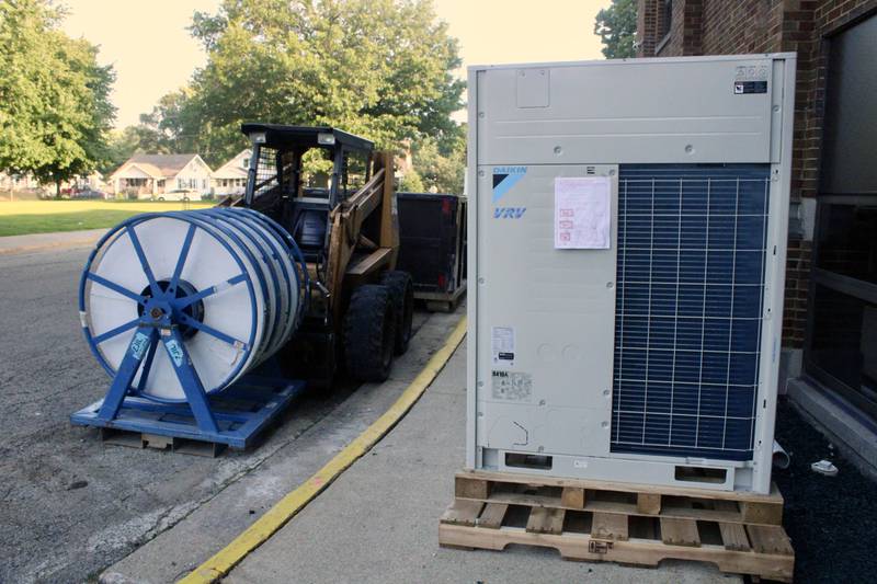A ventilation unit sits on a pallet outside the cafeteria east entrance on Wednesday at Rock Falls High School. Federal COVID-19 recovery funds were used in the installation of heat, air and ventilation units at the school's kitchen, cafeteria and gymnasium.