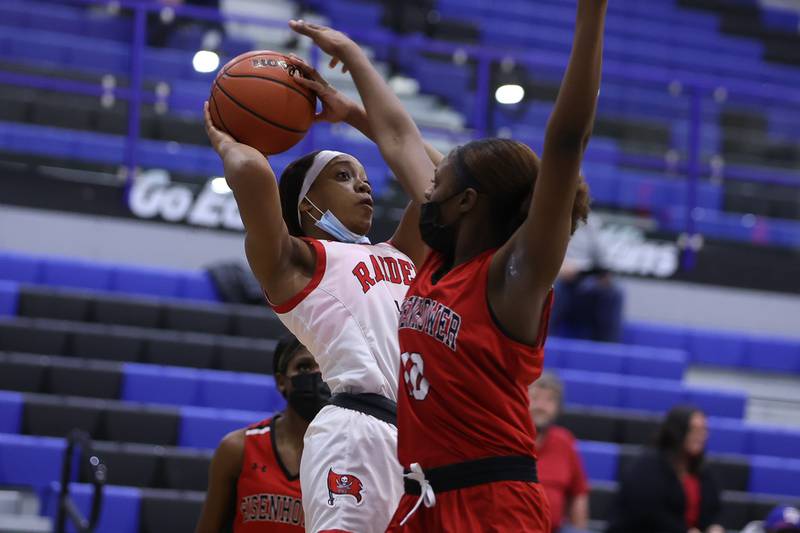 Bolingbrook’s Miranda Fry battles for a shot against Eisenhower in the Class 4A Lincoln-Way East Regional semifinal. Monday, Feb. 14, 2022, in Frankfort.