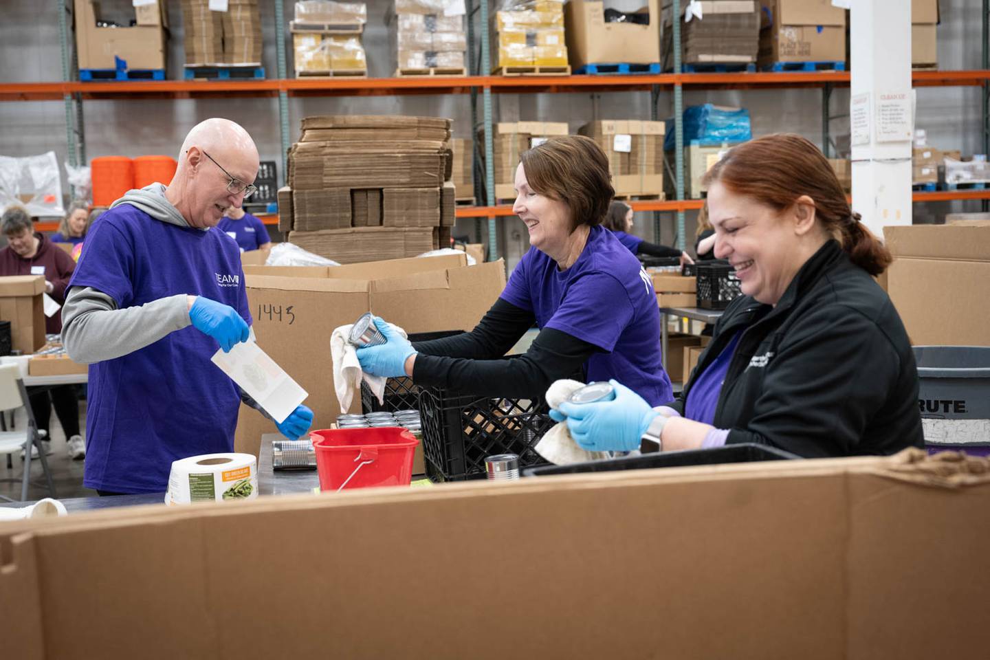 More than 100 volunteers from Northwestern Medicine came out to the Northern Illinois Food Bank's Geneva location to pack up donations on Saturday, Feb. 24, 2024. Northwestern Medicine donated $200,000 across area food banks including three NIL food bank locations — Geneva, Joliet and Lake Forest — and the Greater Chicago Food Depository.
