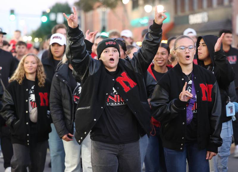 Northern Illinois University clubs and athletes march through downtown DeKalb Thursday, Oct. 17, 2024, during the parade at the Huskie Homecoming Block Party.