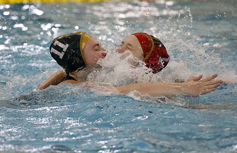 Stevenson's Caroline Bichkoff (11) and  Elsa Kusevskis (1) celebrate their win during the IHSA State Finals of the Girls Water Polo Saturday, May 24, 2025 at Stevenson High School in Lincolnshire.