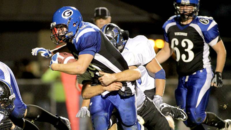 Geneva running back Connor Quinn is tackled near the end zone during Friday's game against St. Charles North in Geneva.