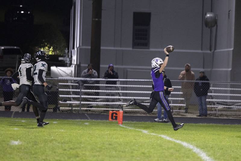 Dixon’s Jagger Kemp runs it in for a TD against Woodstock North Friday, Oct. 31, 2025, in the Class 4A football first round playoffs.