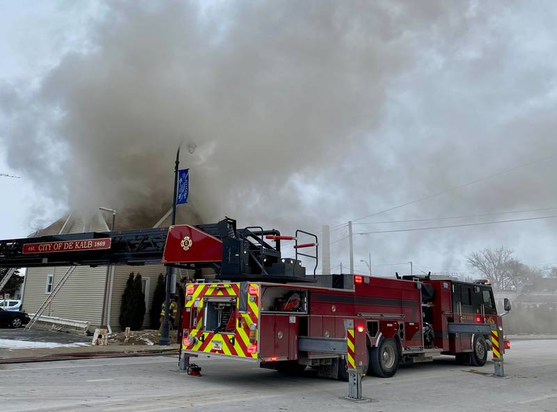 A DeKalb Fire Department ladder truck sits staged along the 700 block of East Lincoln Highway as crews worked a structure fire at a two-story duplex on Saturday, Jan. 24, 2026, in downtown DeKalb.