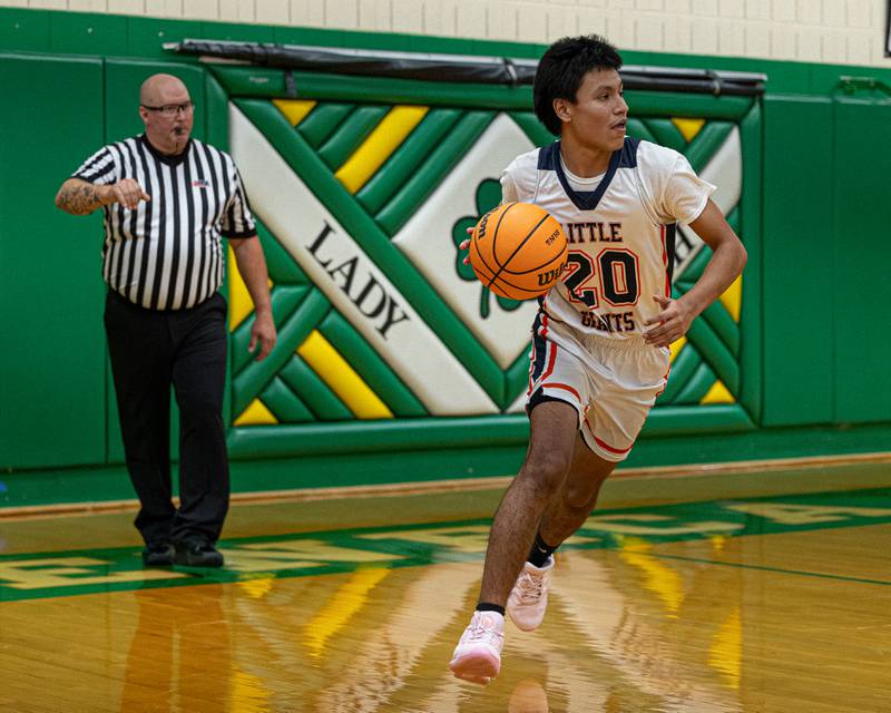 Nico Lopez (20) of DePue dribbles ball down court during game against Reed-Custer in the Shipyard Showdown on Tuesday, December 23, 2025 at Seneca High School in Seneca.