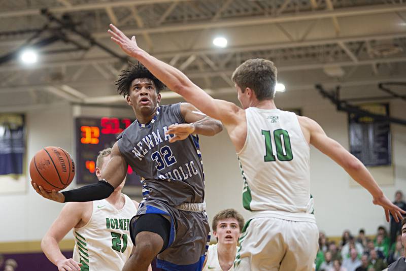 Newman's Marcus Williams goes to the hoop against Scales Mound in the sectional final Friday, March 4, 2022.