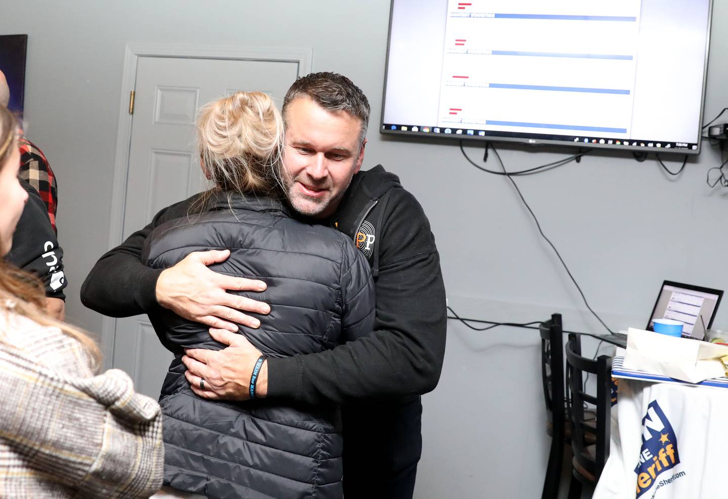 Kane County Sheriff Ron Hain greets supporters as they await Election Night results at Bar Evolution in Batavia on Tuesday, Nov. 8, 2022.