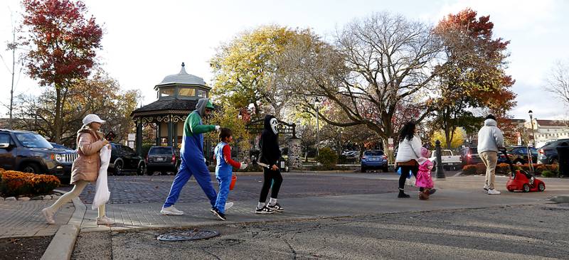 Trick or treaters make their way around the Woodstock Square during Halloween on the Square on Thursday, Oct. 31, 2024, in Woodstock.