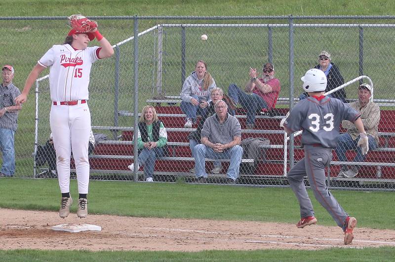 The ball sails over the head of Ottawa first baseman Brendyn Fuchs as L-P's Jett Hill is safe at first on Friday, May 2, 2025 at Ottawa High School.
