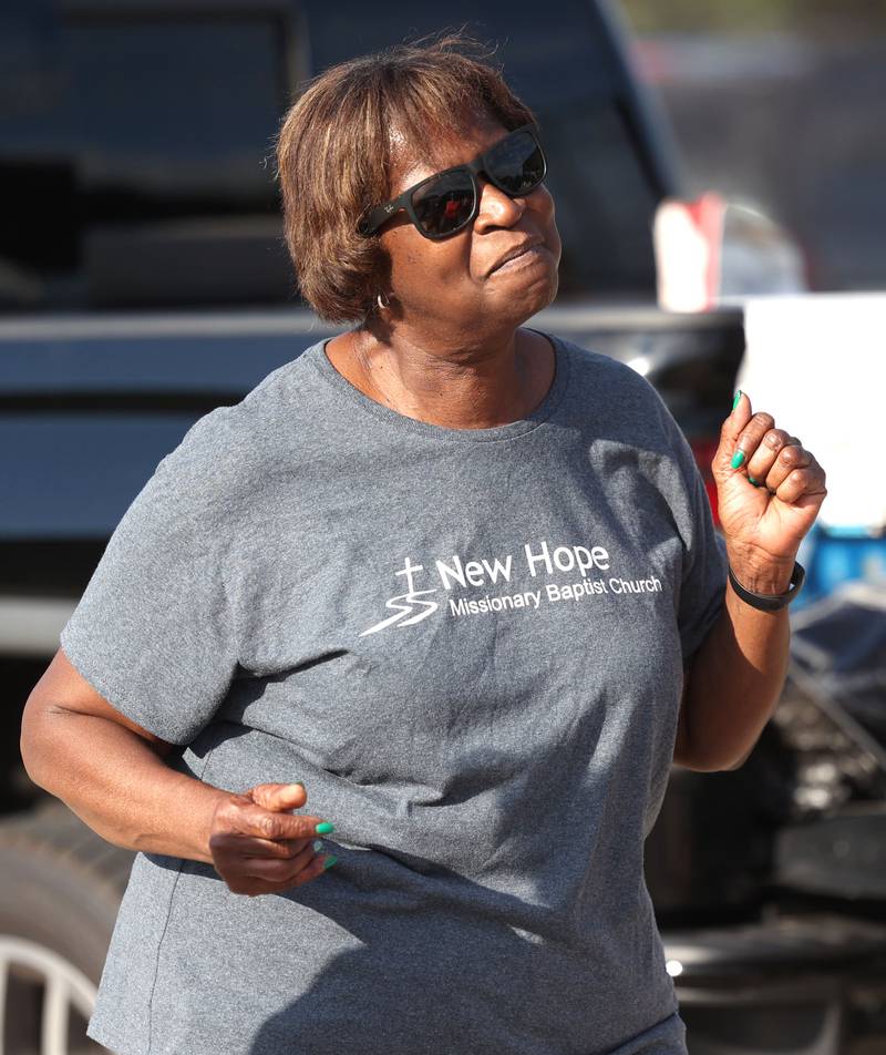 Bonita Gordon, from DeKalb, dances to the music Friday, July 18, 2025, during the DeKalb Peace Walk and Rally. The event, which featured a march, food vendors and music, was held to encourage the community to work together against gun violence.
