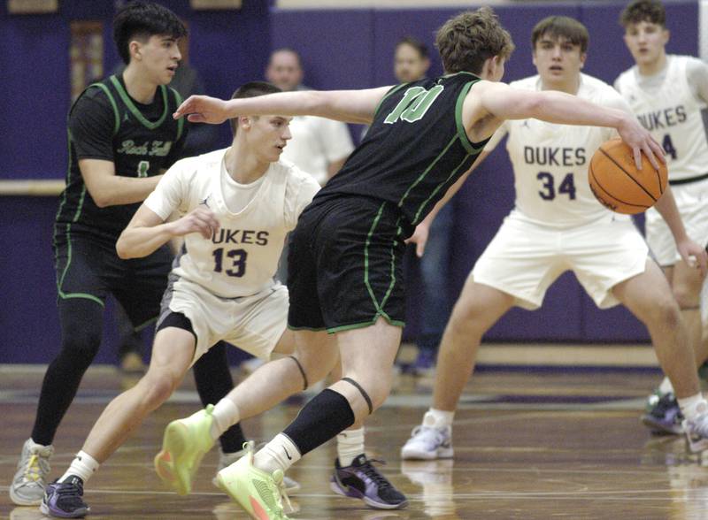 Rock Falls player Kultim Heald gets the ball past Dixon's Cullen Shaner. Dixon hosted Rock Falls in boys basketball Friday, February 14, 2025 at Lancaster Gym at Dixon High School. Rock Falls won a hard fought game 48-46.
