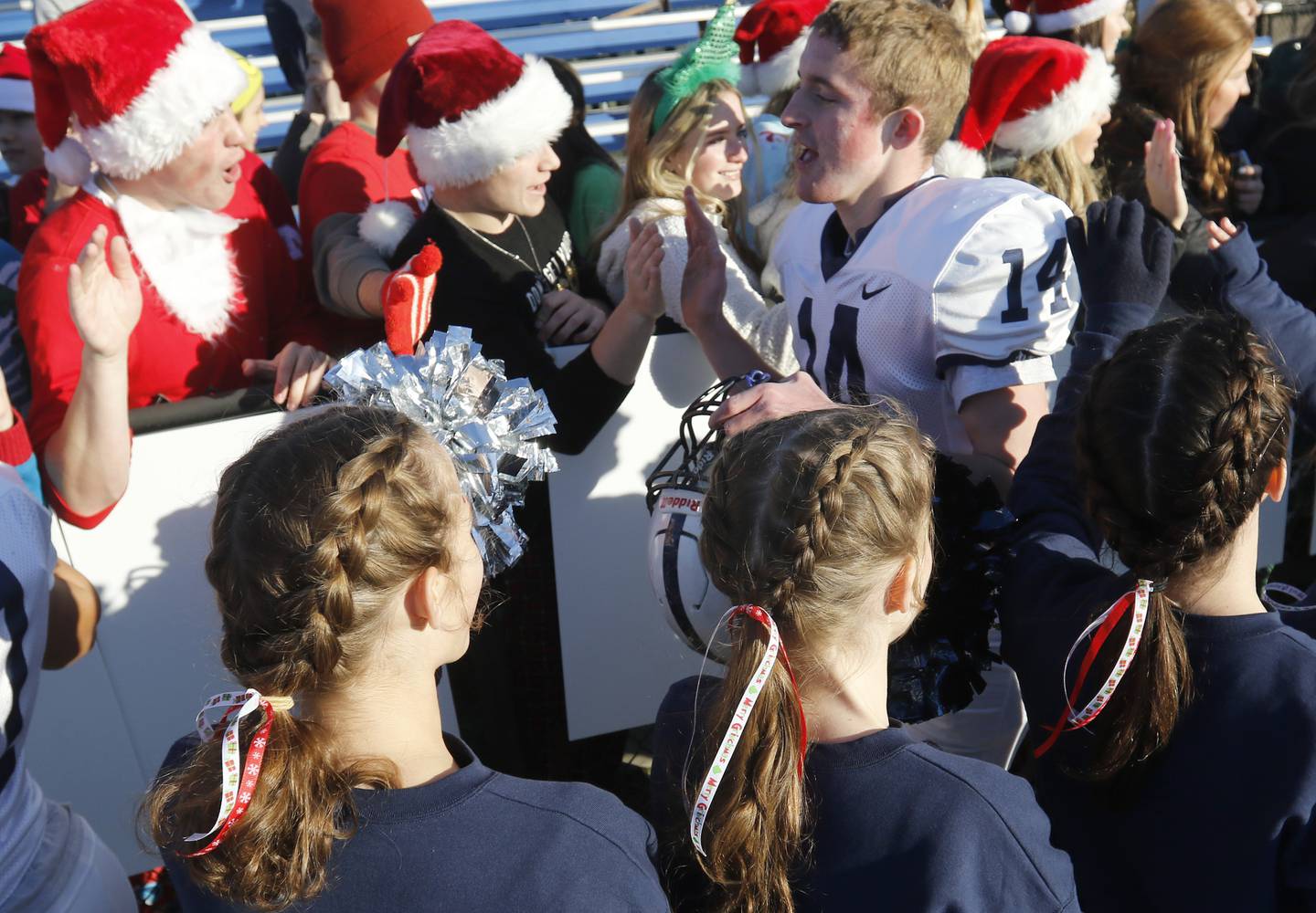 Cary-Grove's Brady Seaburg receives high fives from fans after defeating Lake Zurich in a IHSA Class 6A semifinal playoff football game on Saturday, Nov. 18, 2023, at Lake Zurich High School.