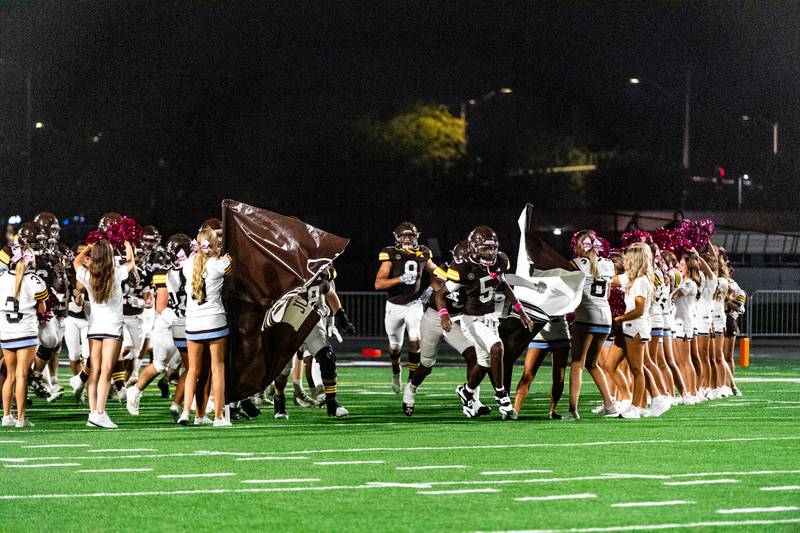 Joliet Catholic Academy takes the field prior to a game against Notre Dame on Friday Oct. 3, 2025 at Busey Bank Field in Joliet