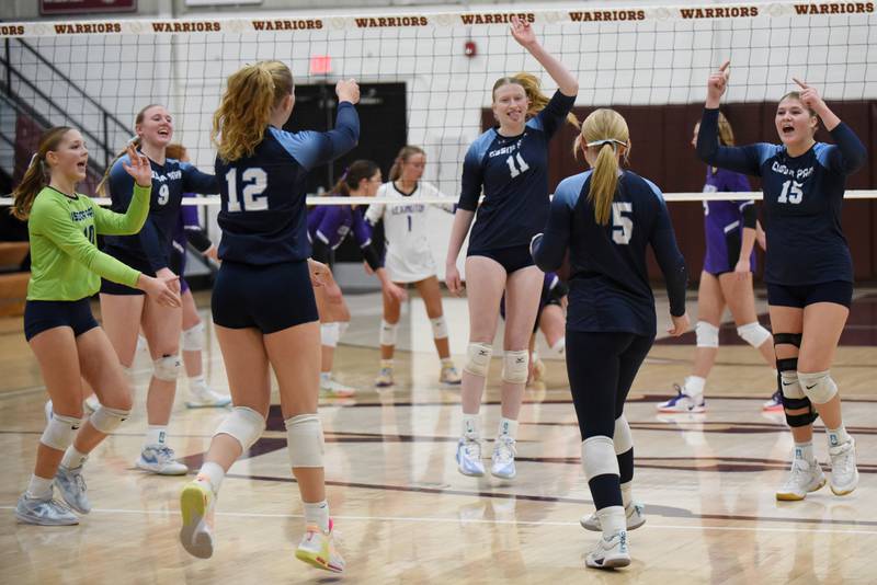 Members of the Cissna Park girls volleyball team celebrate one of the final points of the Timberwolves' 25-16, 25-9 win over Lexington in the IHSA Class 1A Watseka Sectional championship Thursday, Nov. 6, 2025.